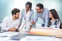 Multiethnic diverse group of creative team, casual business people in strategic meeting or project brainstorm in modern office.