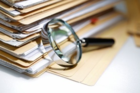 Magnifying glass Search Documents ; shot with very shallow depth of field